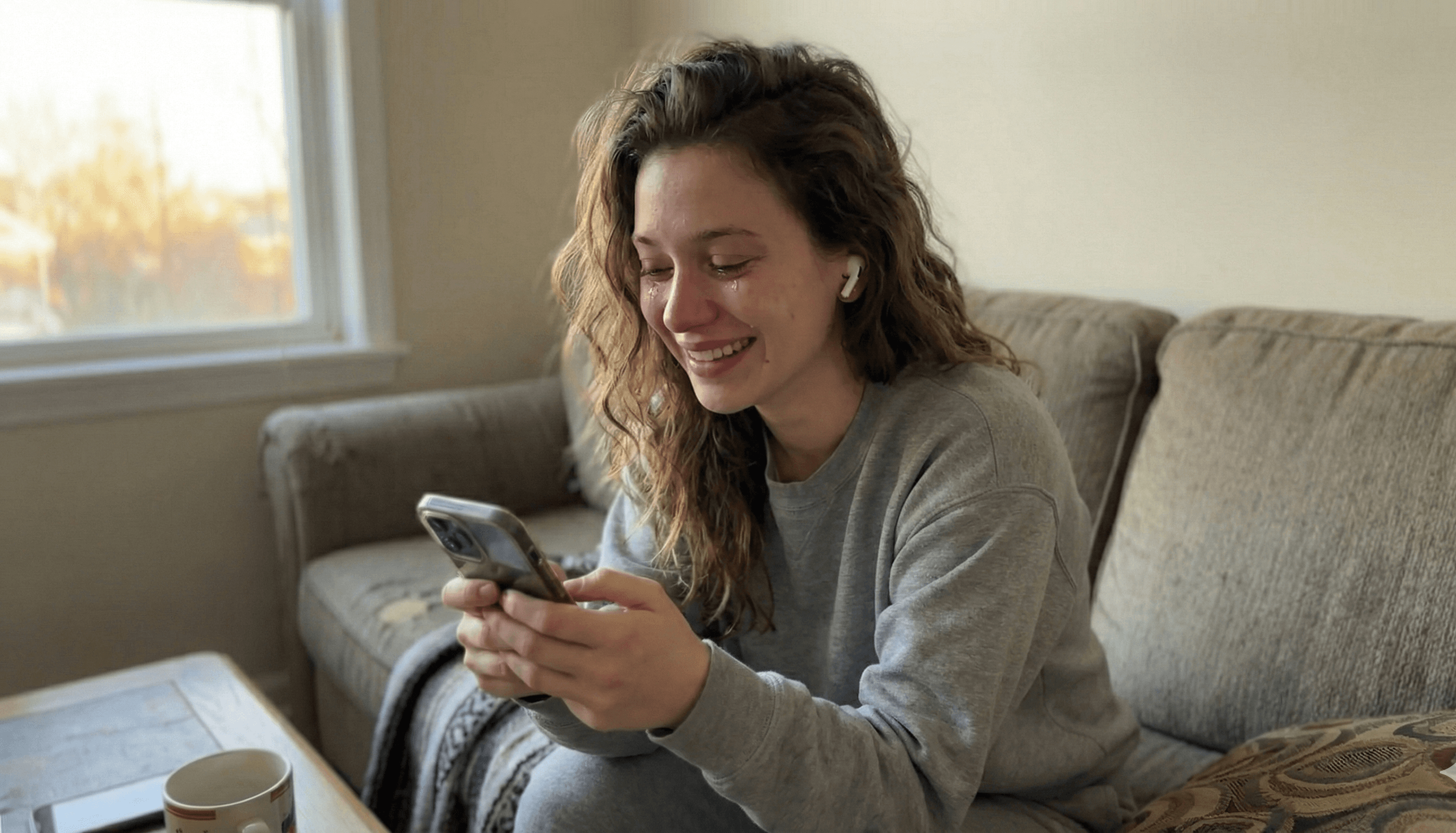 Woman crying happy tears while listening to her personalized love song